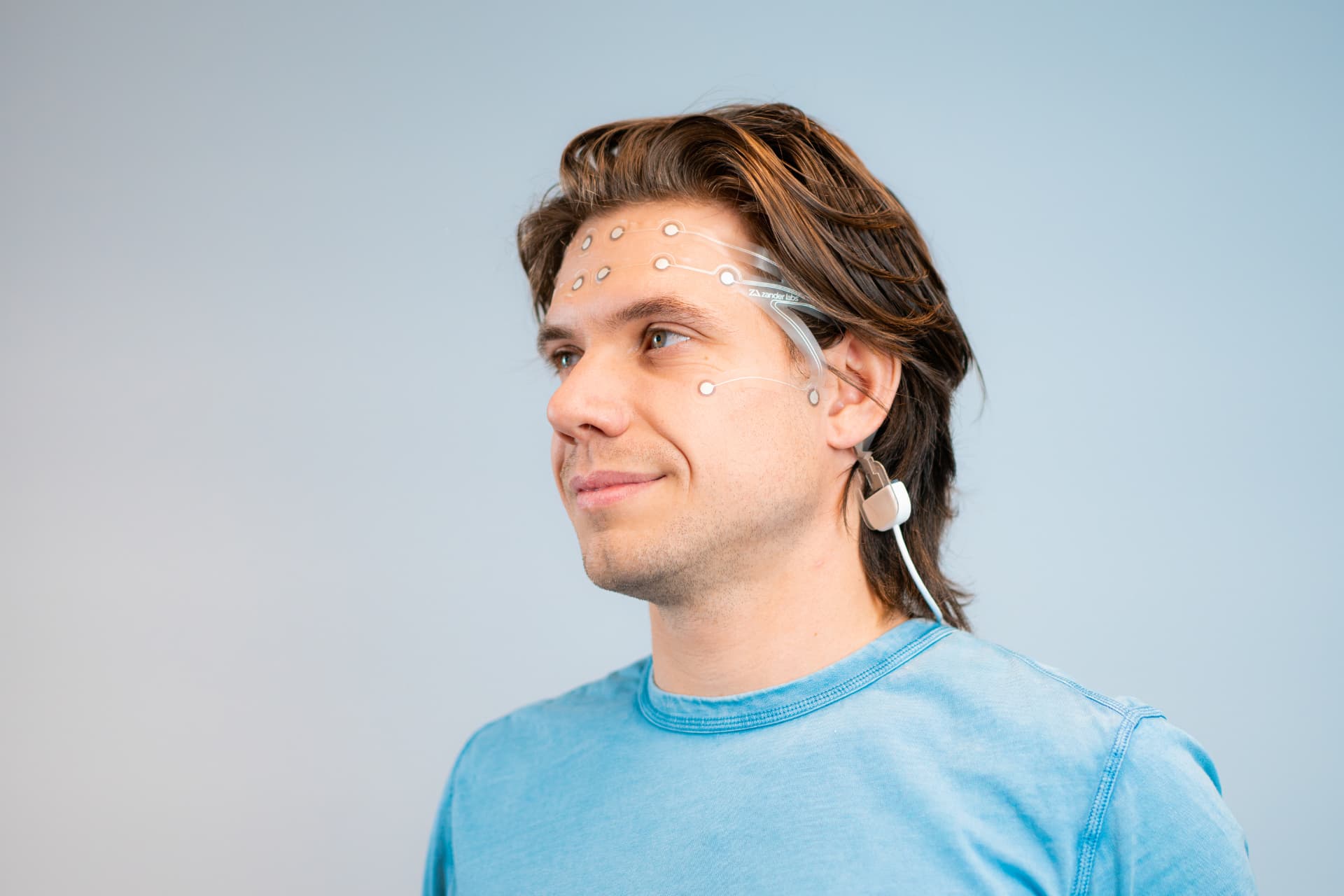 Research participant wearing the SAMANAI EEG sensor strip
